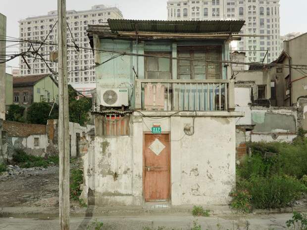 Трущобы упрямых китайцев, отказывающихся переселяться в квартиры (23 фото)