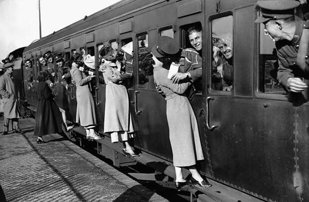 Soldiers Departing For Egypt Lean Out Of Their Windows To Kiss Their Loved Ones Goodbye, 1935