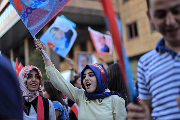 Aug. 13, 2014 - Istanbul, Turkey - A Turkish girl wears a head band that reads ''Recep Tayyip Erdogan'' as she holds Turkey flag during a rally march for celebrate presidential victory of Erdogan in Istanbul August 13, 2014. Erdogan secured his place in history as Turkey's first directly elected president on Sunday, sweeping more than half the vote in a result his opponents fear heralds an increasingly authoritarian state. (Credit Image: © Ahmed Deeb/NurPhoto/ZUMA Wire)