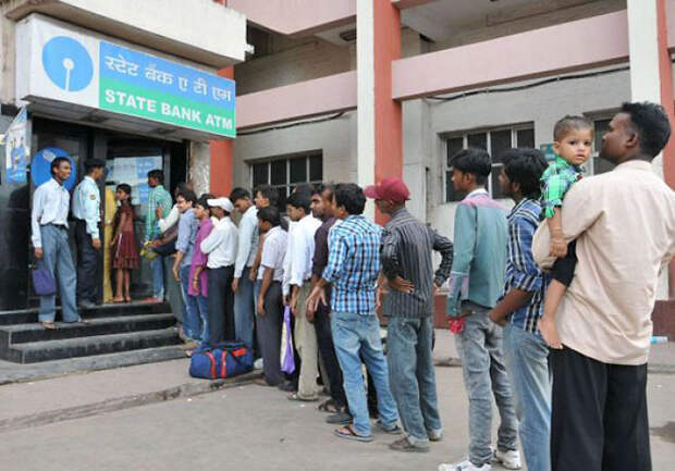 Man Withdrawing Cash From An Atm In India