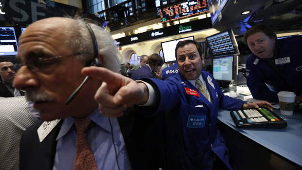 Barclays specialist trader Michael Pistillo shouts out a price just after the opening bell on the floor at the New York Stock Exchange