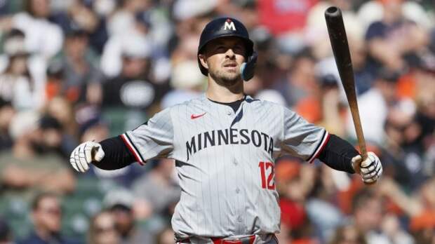 Minnesota Twins infielder Kyle Farmer stretches during an at-bat.