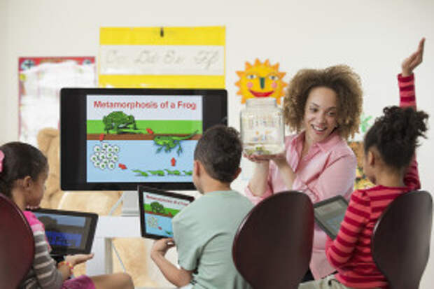 Students using digital tablets in class