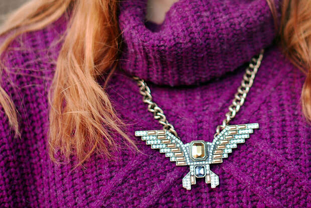 Purple knitwear and statement necklace