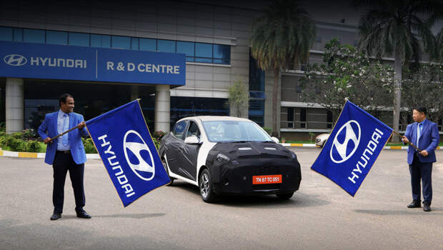 Hyundai aura. Замаскированный прототип Ауры на днях стартовал с завода в Ченнаи, чтобы проехать через всю Индию, «готовясь к победе в сегменте седанов». Побеждать ему придётся модели Maruti Suzuki Dzire, Honda Amaze, Ford Aspire, Tata Tigor и другие.