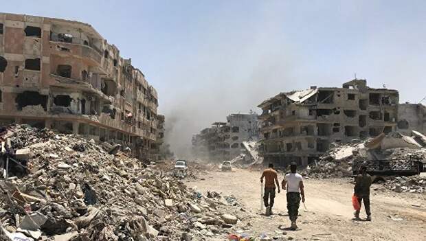 Разрушенные дома в освобожденном лагере палестинских беженцев Ярмук на юге Дамаска