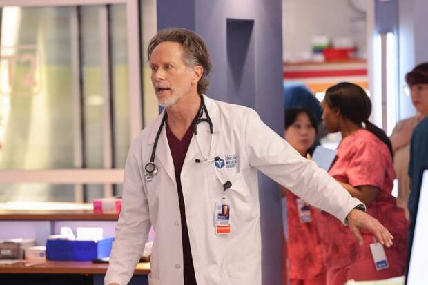 Archer running toward an emergency on Chicago Med Season 10 Episode 17