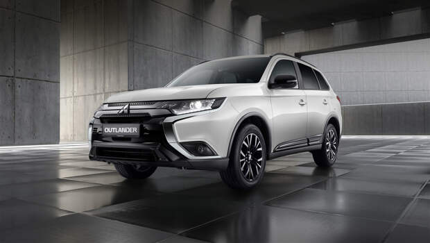 Mitsubishi outlander. Кузов окрашивается в белый «перламутр» или чёрный «металлик». Считается, что в обоих случаях доминирует чёрный, ведь в этом цвете выполнены накладки на решётку и бамперы, корпуса наружных зеркал и 18-дюймовые легкосплавные диски. Все хромированные элементы затемнены.