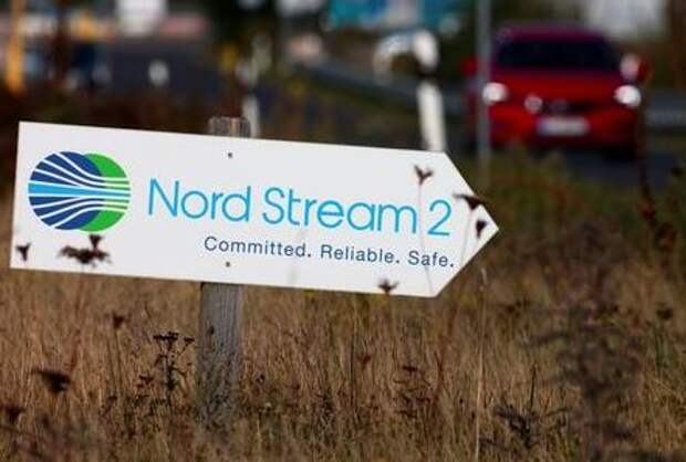 A road sign directs traffic towards the Nord Stream 2 gas line landfall facility entrance in Lubmin, Germany, September 10, 2020. REUTERS/Hannibal Hanschke