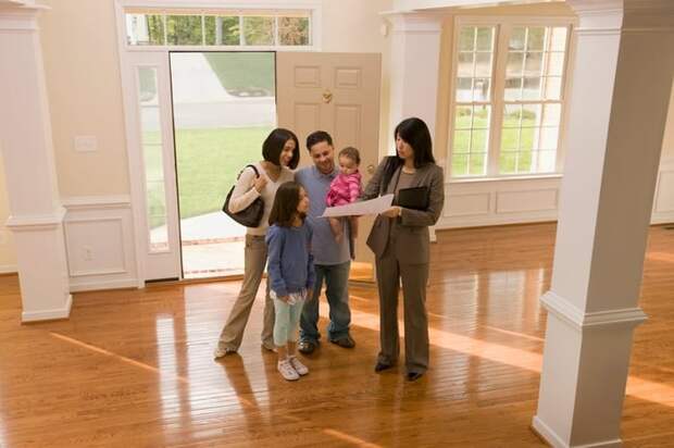 Family touring home with realtor.