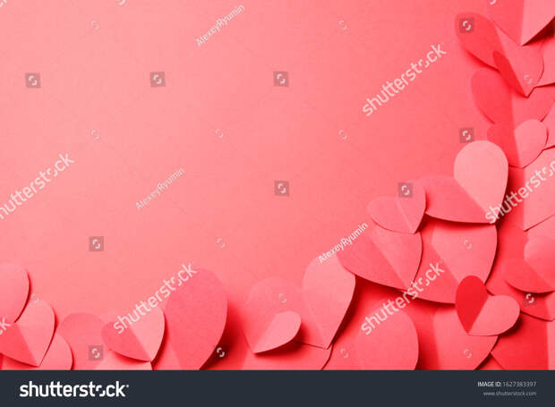 Cut out of red paper hearts on red background. Good Valentines day, Womans day, love, romantic or wedding composition with copy space for your text for banner, congratulation, card, offer, flyer, advertising, invitation.