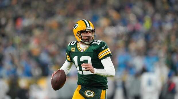 Aaron Rodgers drops back to pass