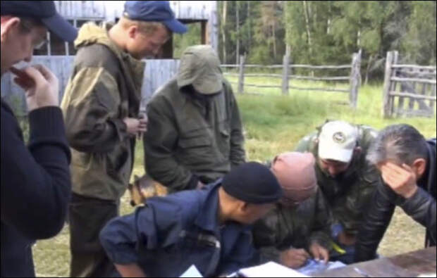 Rescuers discuss the plan of rescue operation