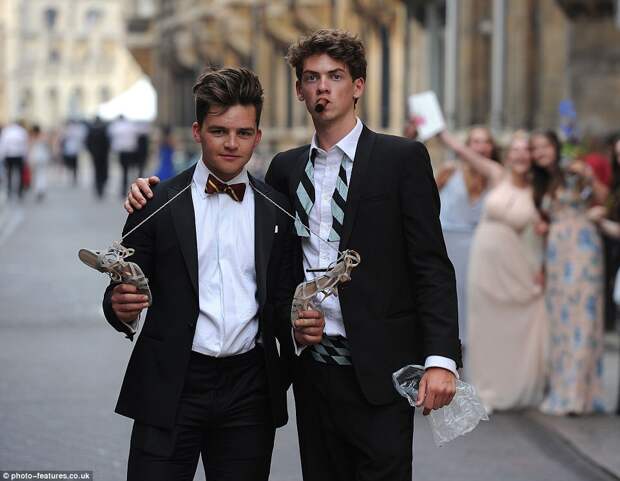 Partygoers puffed on cigars as they made their way home, with one guest carrying a female friend's stilettos around his neck