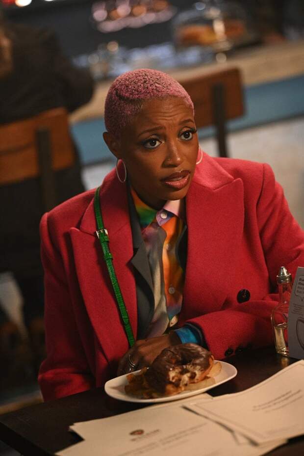 Kylie eating a burger and advising Phoebe on The Irrational Season 2 Episode 4