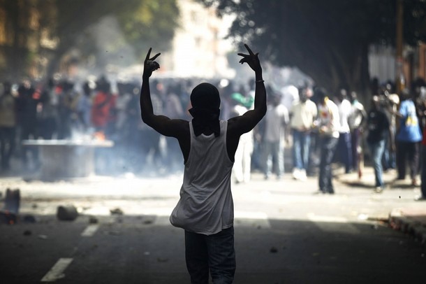 A protester gestures during a violent demonstration in Senegal's capital Dakar