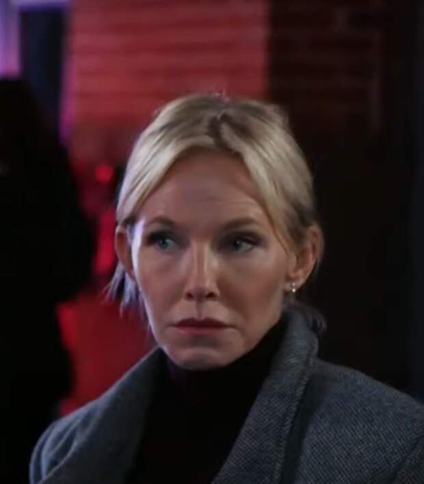 Rollins wearing a gray coat outside a nightclub on Law & Order: SVU Season 26 Episode 3