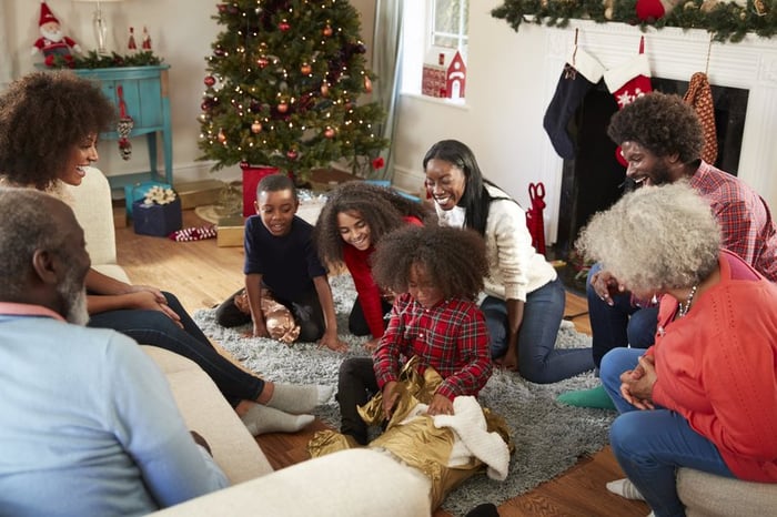 A family opening gifts on Christmas morning.
