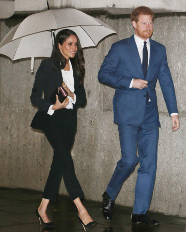 Meghan Markle and Prince Harry, both in suits.