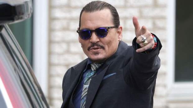 actor johnny depp pointing at the camera