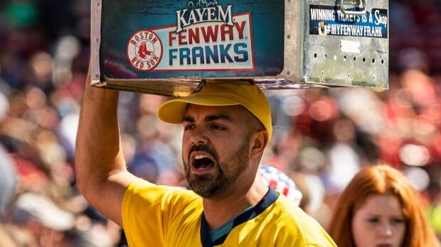 Vendor selling hot dogs at a Red Sox game at Fenway Park