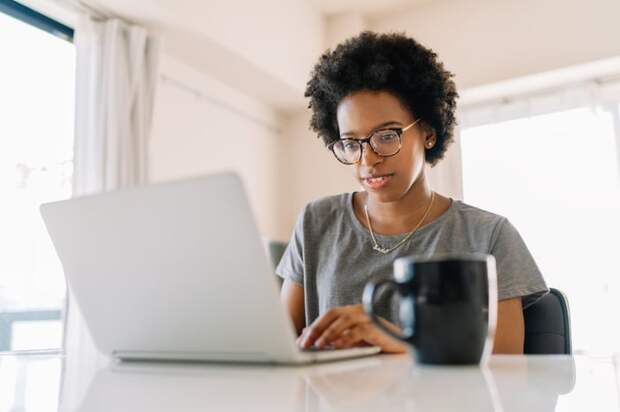 A person typing on a laptop.