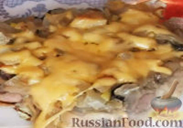 Фото к рецепту: Пельмени, запеченные в духовке