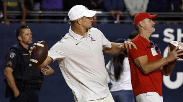 Rob Gronkowski tosses a football.