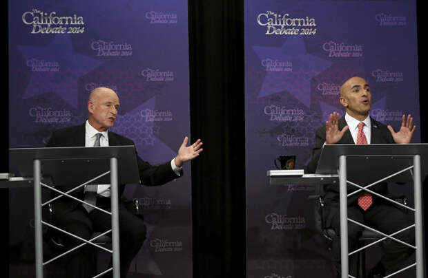 Gov. Jerry Brown, left, and Republican challenger Neel Kashkari both speak during a gubernatorial debate in Sacramento, Calif., Thursday, Sept. 4, 2014.&nbsp; (Rich Pedroncelli/AP Photo/Pool)