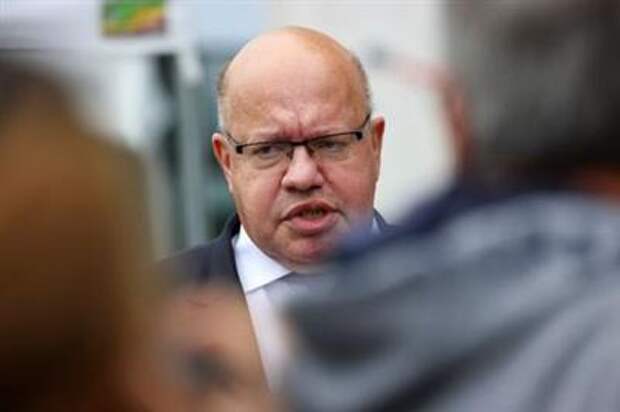 German Economy Minister Peter Altmaier of the Christian Democratic Union (CDU) reacts one day after the German general elections, in Berlin, Germany, September 27, 2021. REUTERS/Fabrizio Bensch