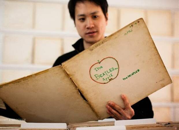 Rutherford Chang -We Buy White Albums ; Rutherford is an American-Taiwaneese artist living in New York & Shanghai ; He collects only first pressing Beatles White Albums ; Photographed at his current show 