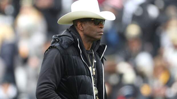 Deion Sanders walks the field during the Colorado spring game.