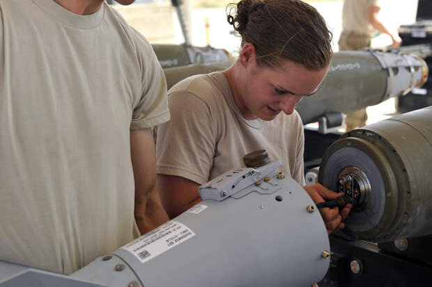 BAGRAM AIRFIELD, Afghanistan -- U.S. Air Force Airman 1st Class Casey Cain, a munitions systems technician currently assigned to the 455th Expeditionary Maintenance Squadron connects an FMU-152 tail fuse during a GBU-38 bomb build. GBU-38s are key weapons