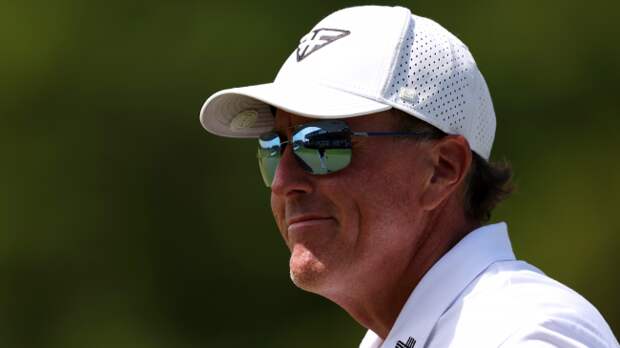 Phil Mickelson reacts to a shot on the course.
