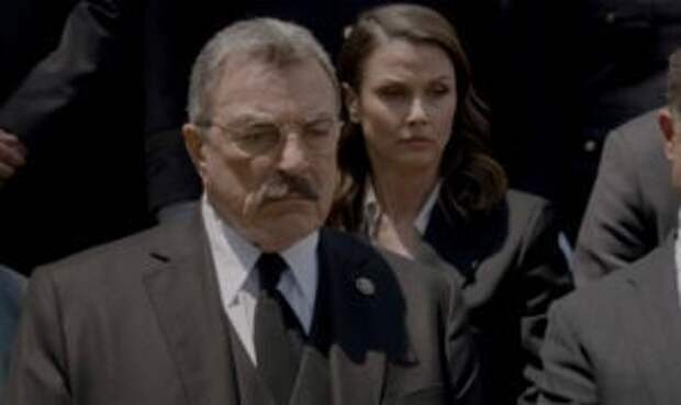 Frank sitting in front of Erin and looking sad on Blue Bloods Season 14 Episode 18