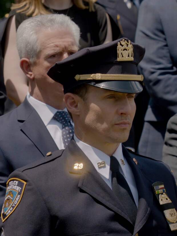 Jamie and Garrett are among the people paying tribute to a fallen cop on Blue Bloods Season 14 Episode 18